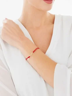 Apart Bransoletka z elementami żółtego złota i diamentem - nieskończoność, litera M, serce - 0,005 ct - próba 375< Wszystkie