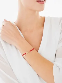Clearance Apart Bransoletka z elementami żółtego złota i diamentem - nieskończoność, litera K, serce - 0,005 ct - próba 375