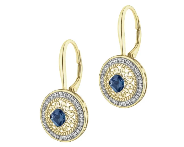 Apart Kolczyki z żółtego złota z diamentami i topazami London Blue - rozeta - próba 585< Kolczyki Z Diamentami