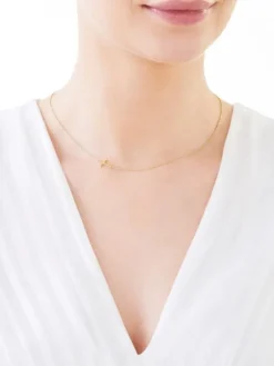 Apart Naszyjnik z żółtego złota z brylantem - krzyż - 0,006 ct - próba 585< Naszyjniki